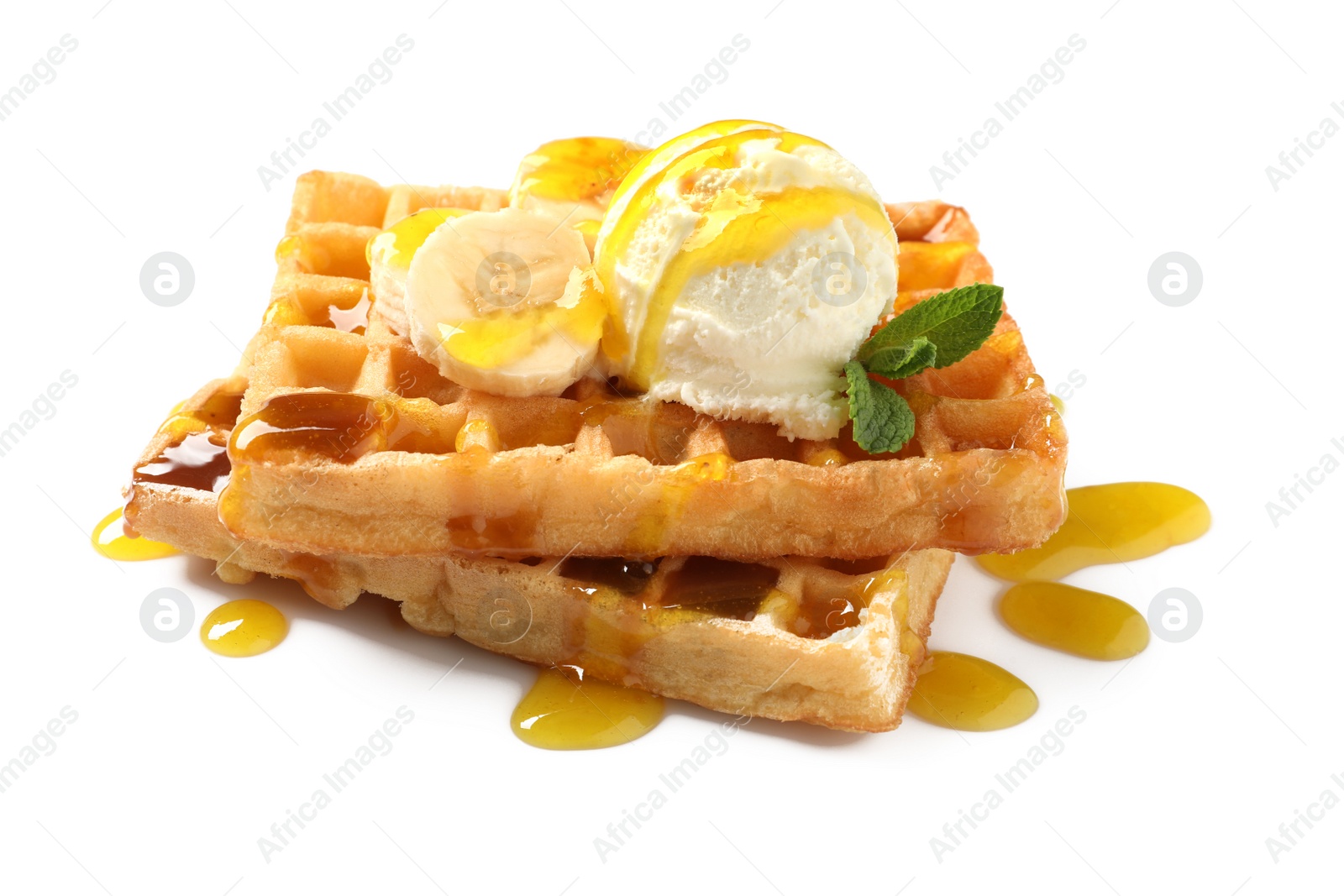 Photo of Delicious waffles with ice cream, banana and syrup on white background