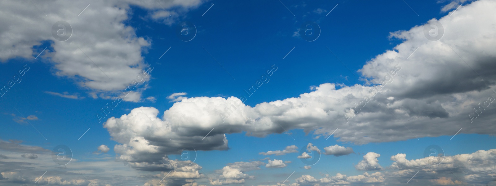 Image of Beautiful blue sky with white fluffy clouds. Banner design