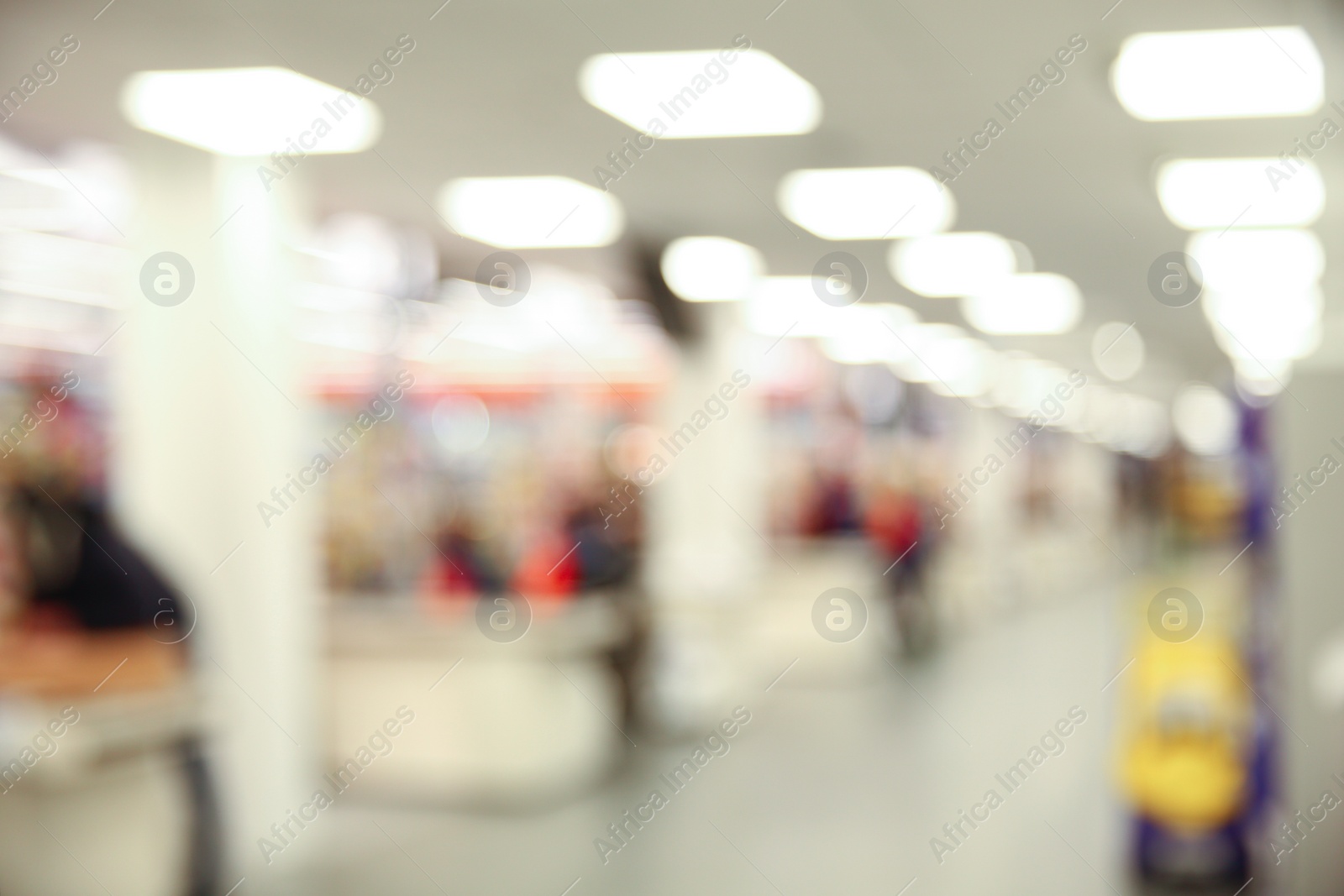 Photo of Blurred view of modern shopping mall interior