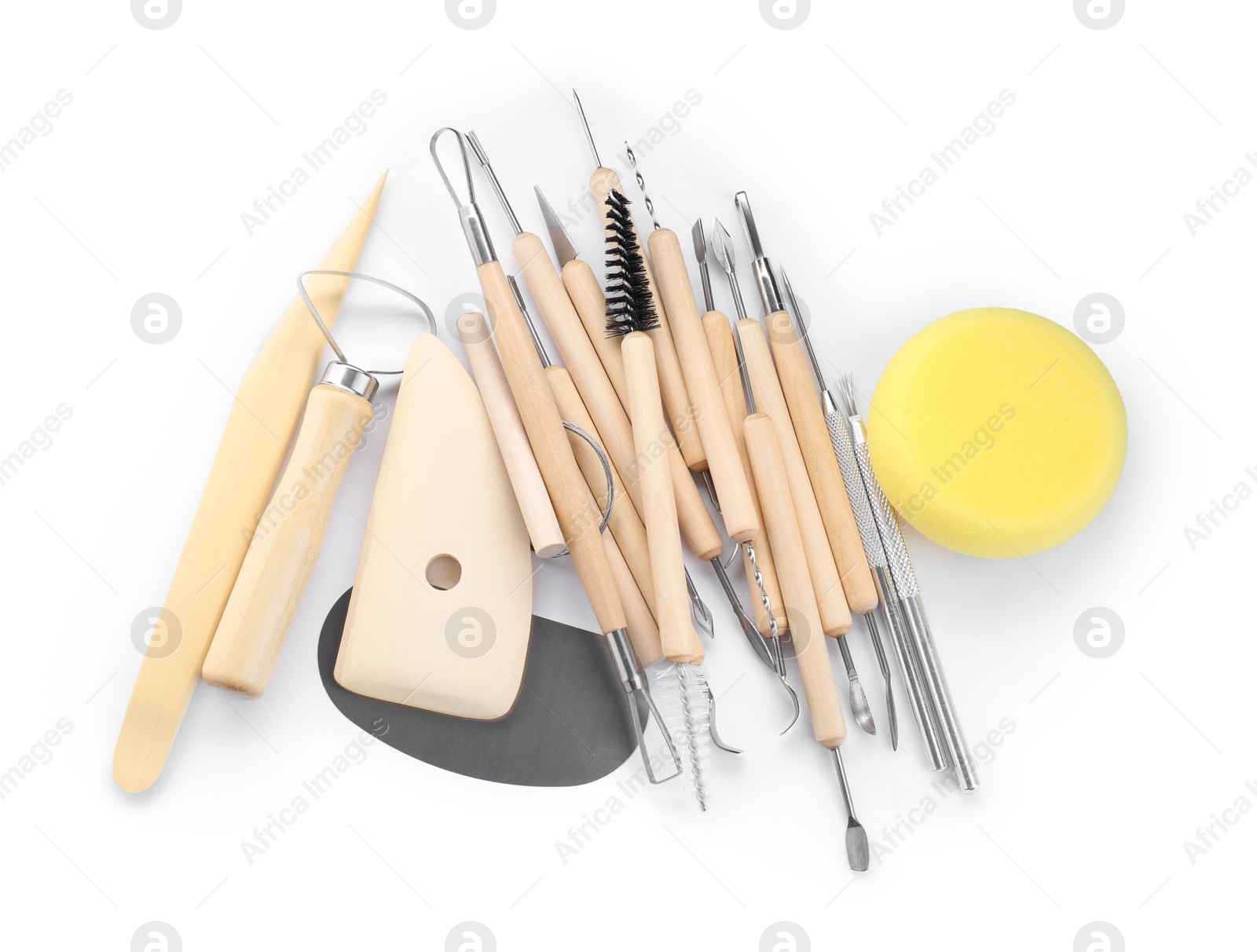 Photo of Set of different clay crafting tools isolated on white, top view