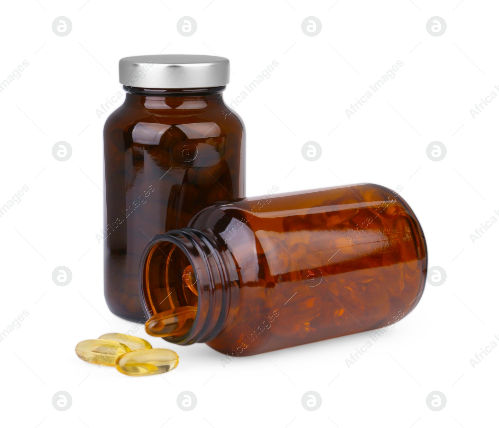 Photo of Vitamin capsules and medical bottles isolated on white