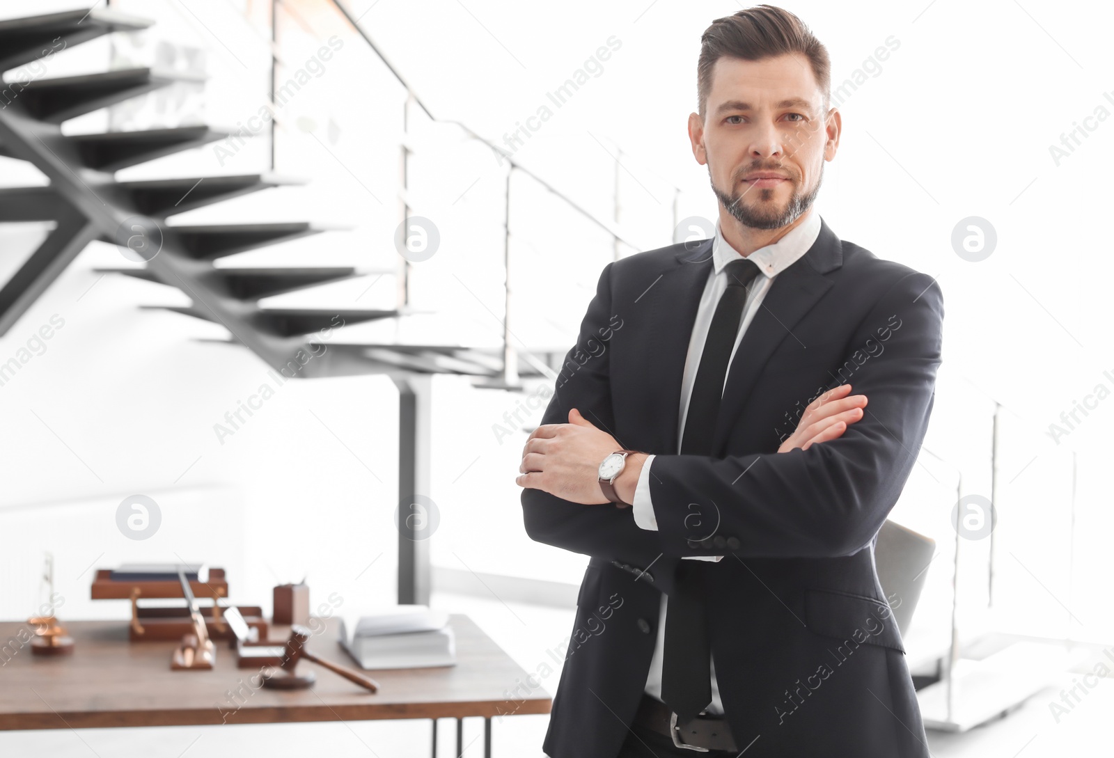 Photo of Male lawyer standing in office