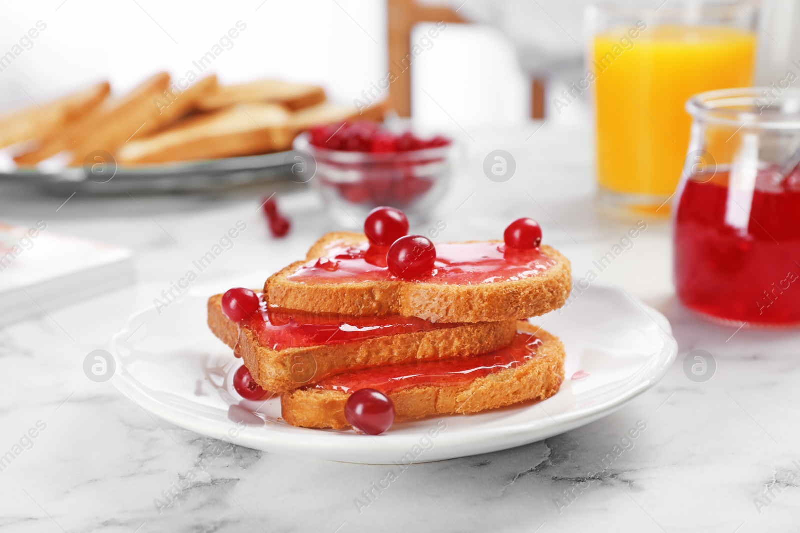 Photo of Toasts with sweet jam on light table