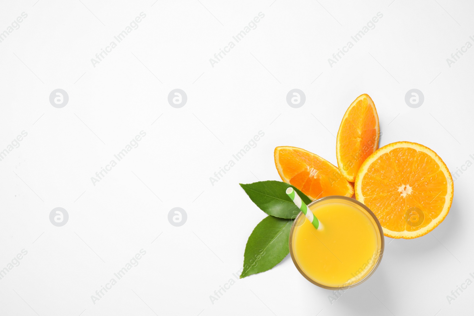 Photo of Glass of orange juice and fresh fruits on white background, top view