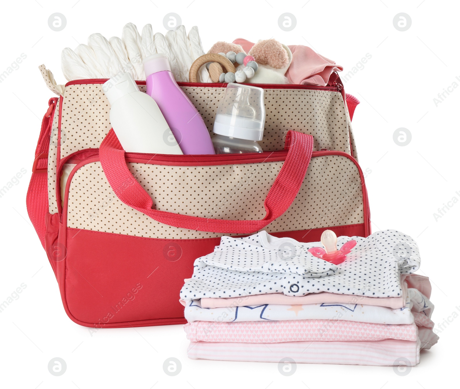 Photo of Mother's bag with baby's stuff isolated on white