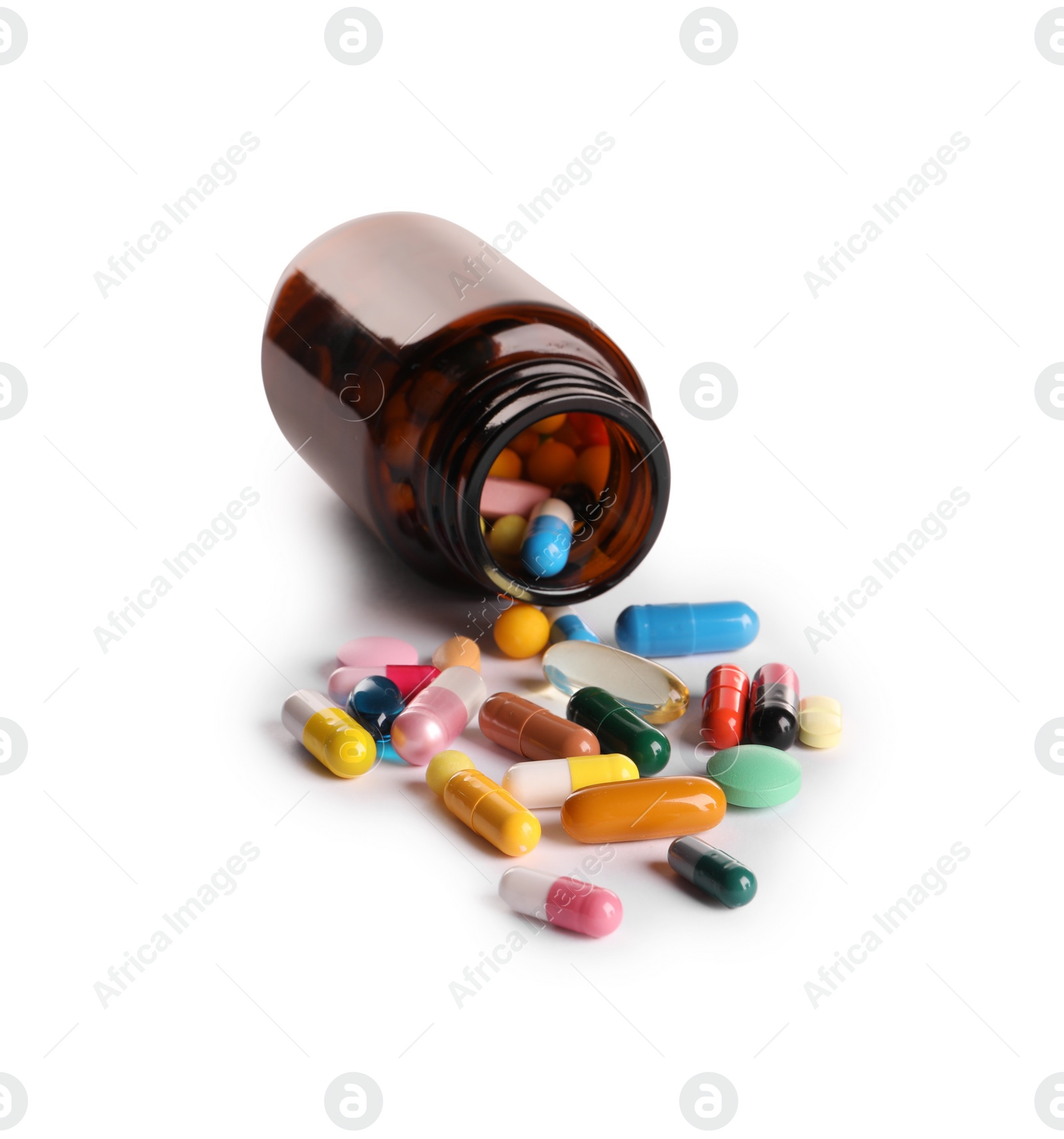 Photo of Plastic medical bottle with many different pills isolated on white