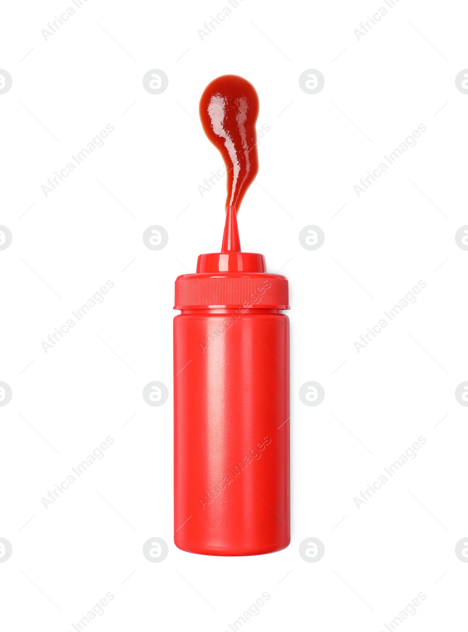 Photo of Squeezed ketchup from red bottle isolated on white, top view