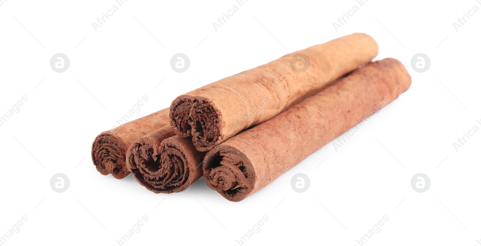 Photo of Dry aromatic cinnamon sticks isolated on white