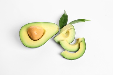 Ripe sliced avocado on white background