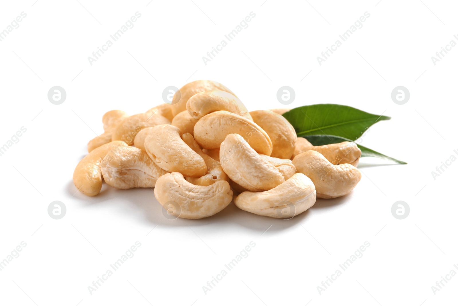 Photo of Tasty cashew nuts with leaves isolated on white