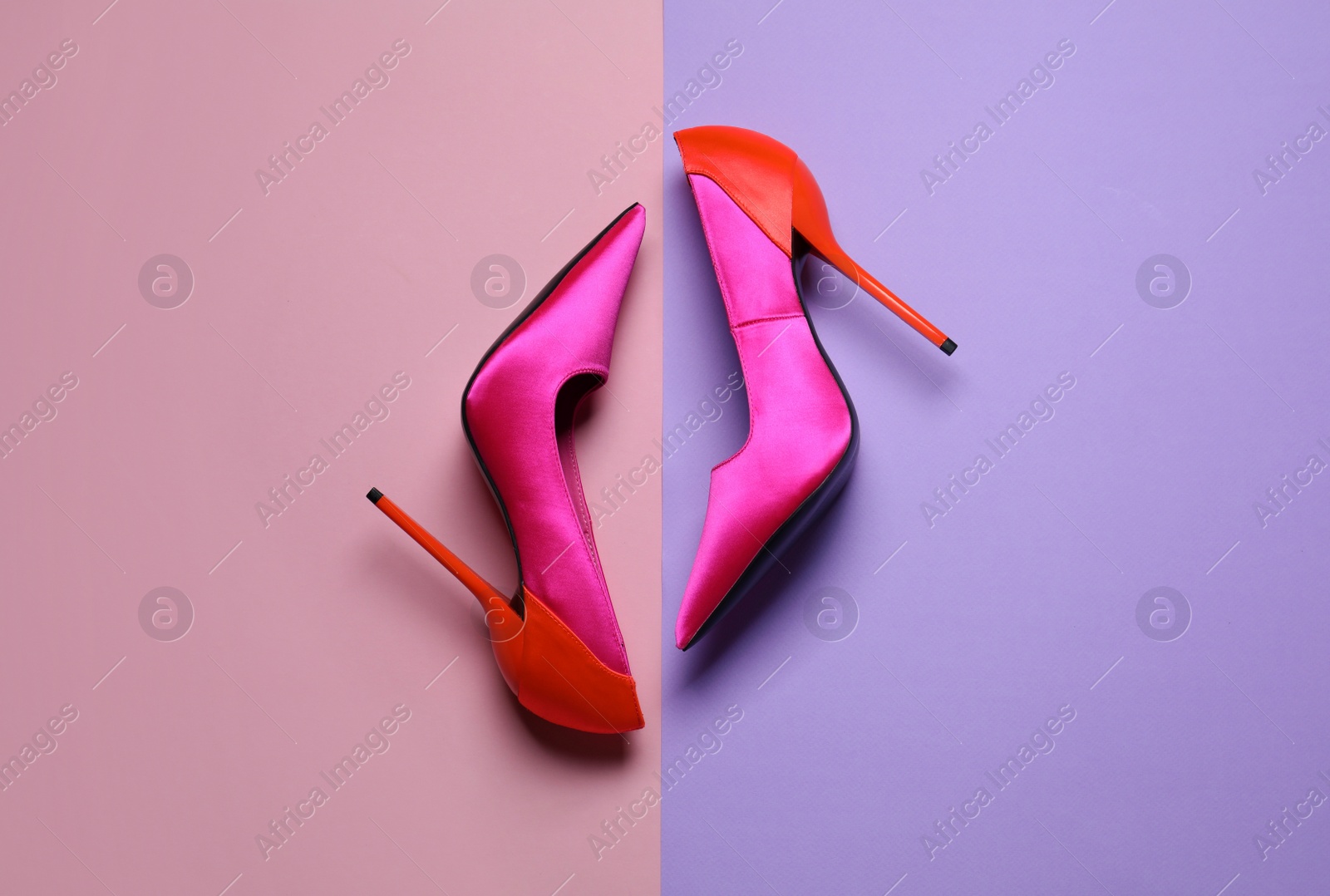 Photo of Pair of beautiful shoes on color background, top view