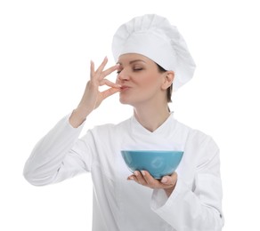 Photo of Woman chef in uniform holding bowl and showing perfect sign on white background