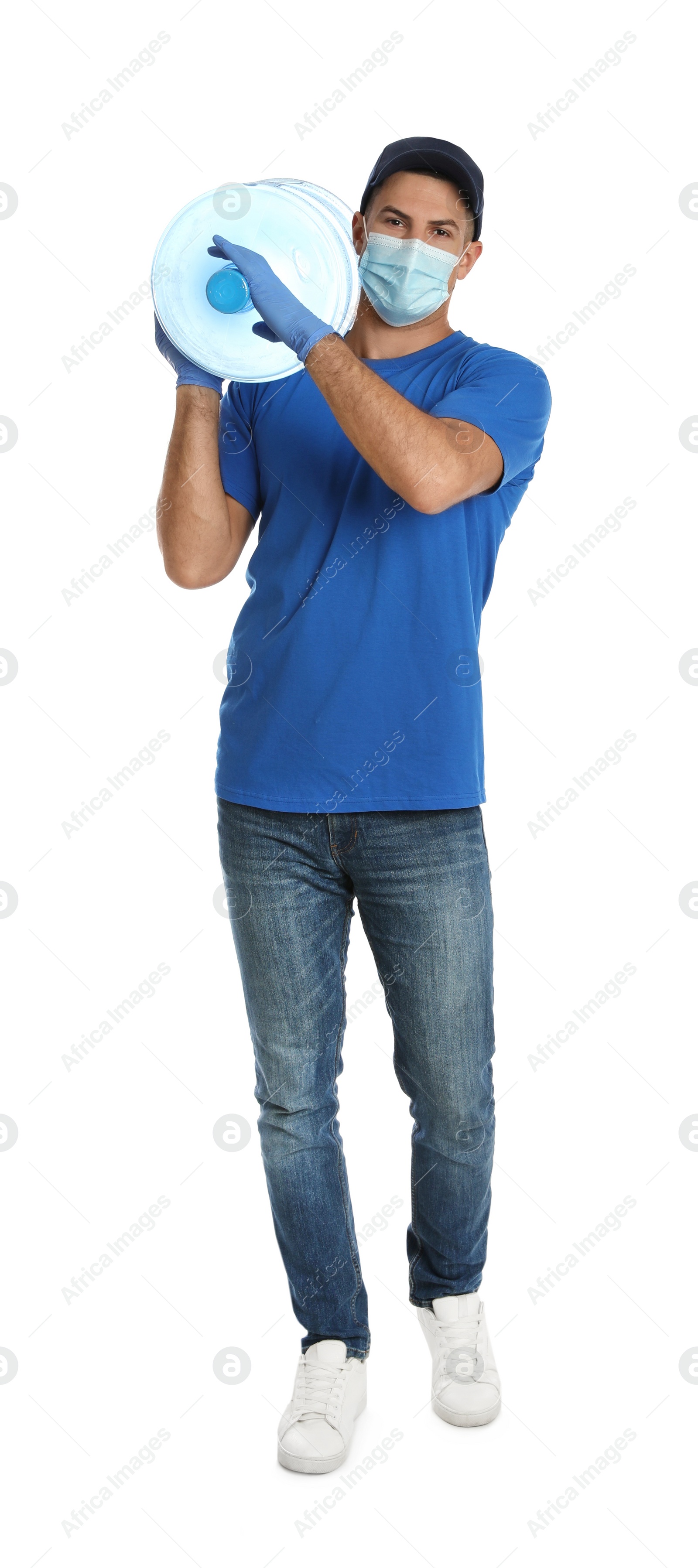 Photo of Courier in face mask with bottle of cooler water on white background. Delivery during coronavirus quarantine