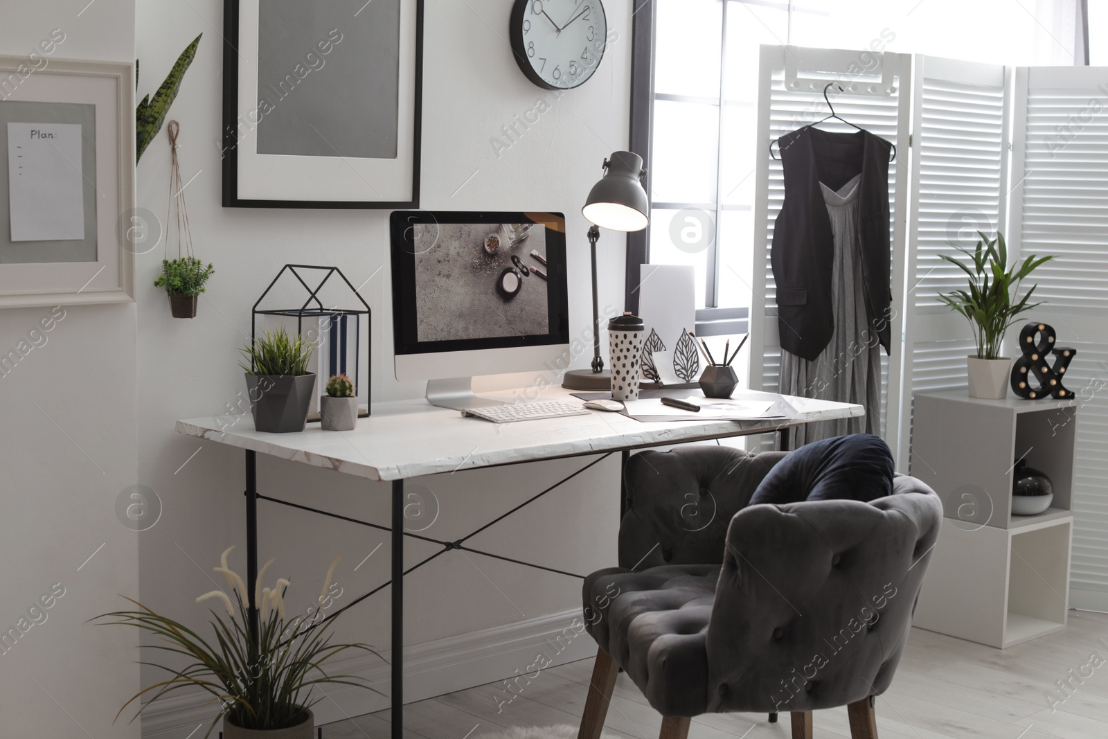 Photo of Stylish workplace with modern computer on desk