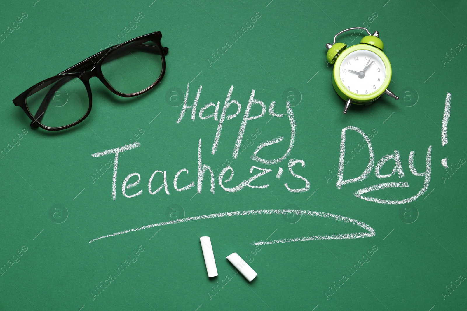 Photo of Flat lay composition with words HAPPY TEACHER'S DAY on chalkboard