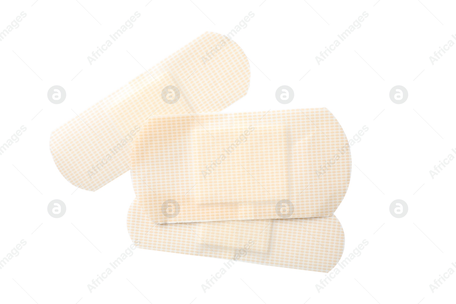 Medical sticking plasters isolated on white. First aid item Photo of Medical sticking plasters isolated on white. First aid item
