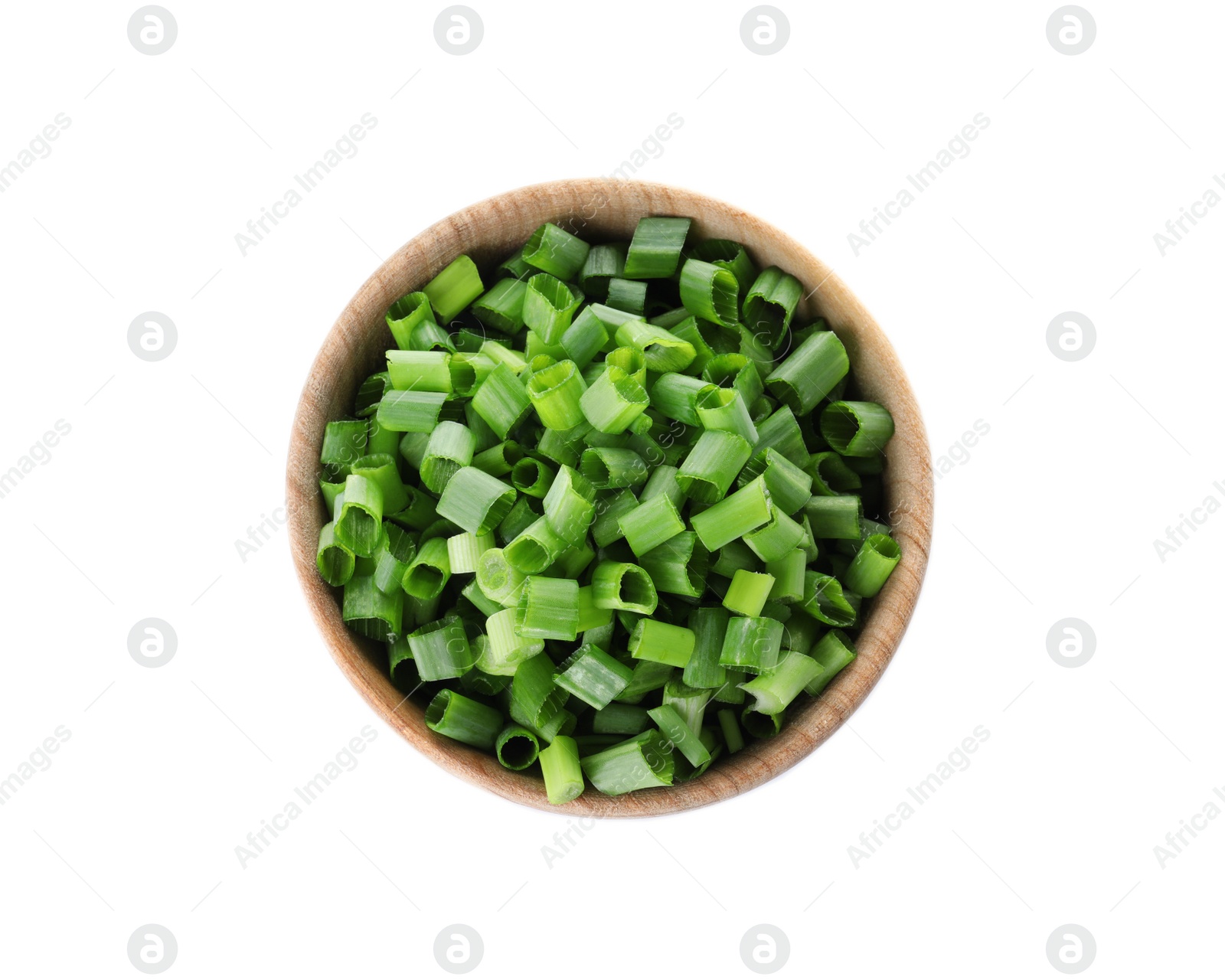 Photo of Wooden bowl of cut green onion on white background, top view