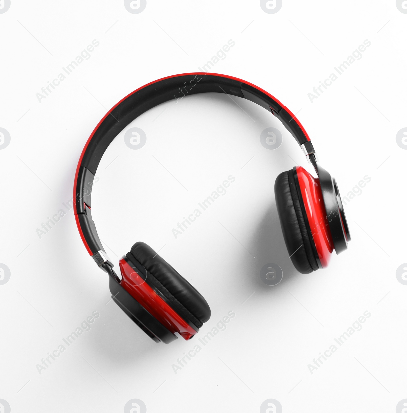 Photo of Stylish modern headphones with earmuffs on white background