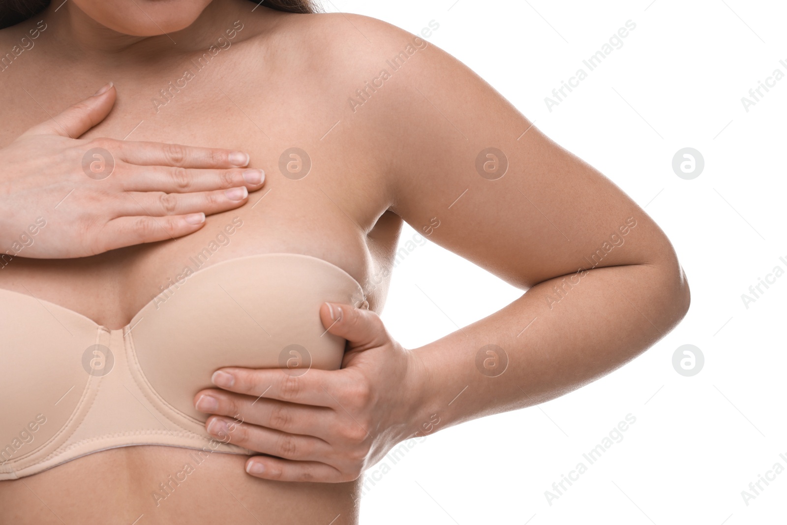 Photo of Mammology. Woman in bra doing breast self-examination on white background, closeup