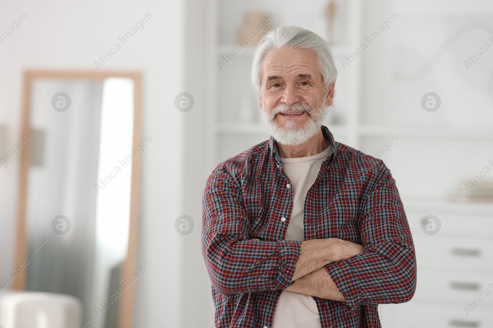 Photo of Portrait of happy grandpa with grey hair indoors