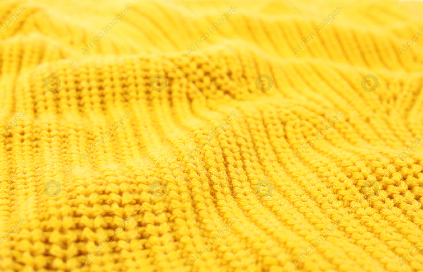 Photo of Texture of cozy warm sweater as background, closeup