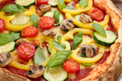 Photo of Delicious hot vegetable pizza with mushrooms as background, closeup