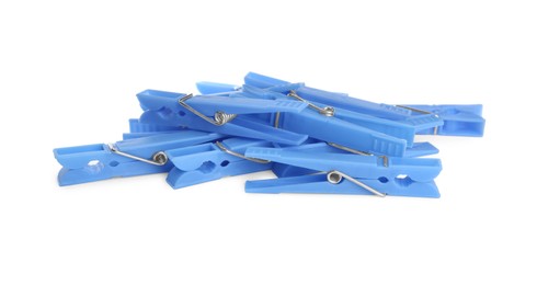 Photo of Light blue plastic clothespins on white background