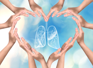 Image of World Tuberculosis Day and No Tobacco campaign. People surrounding lungs illustration, making heart shaped frame with hands