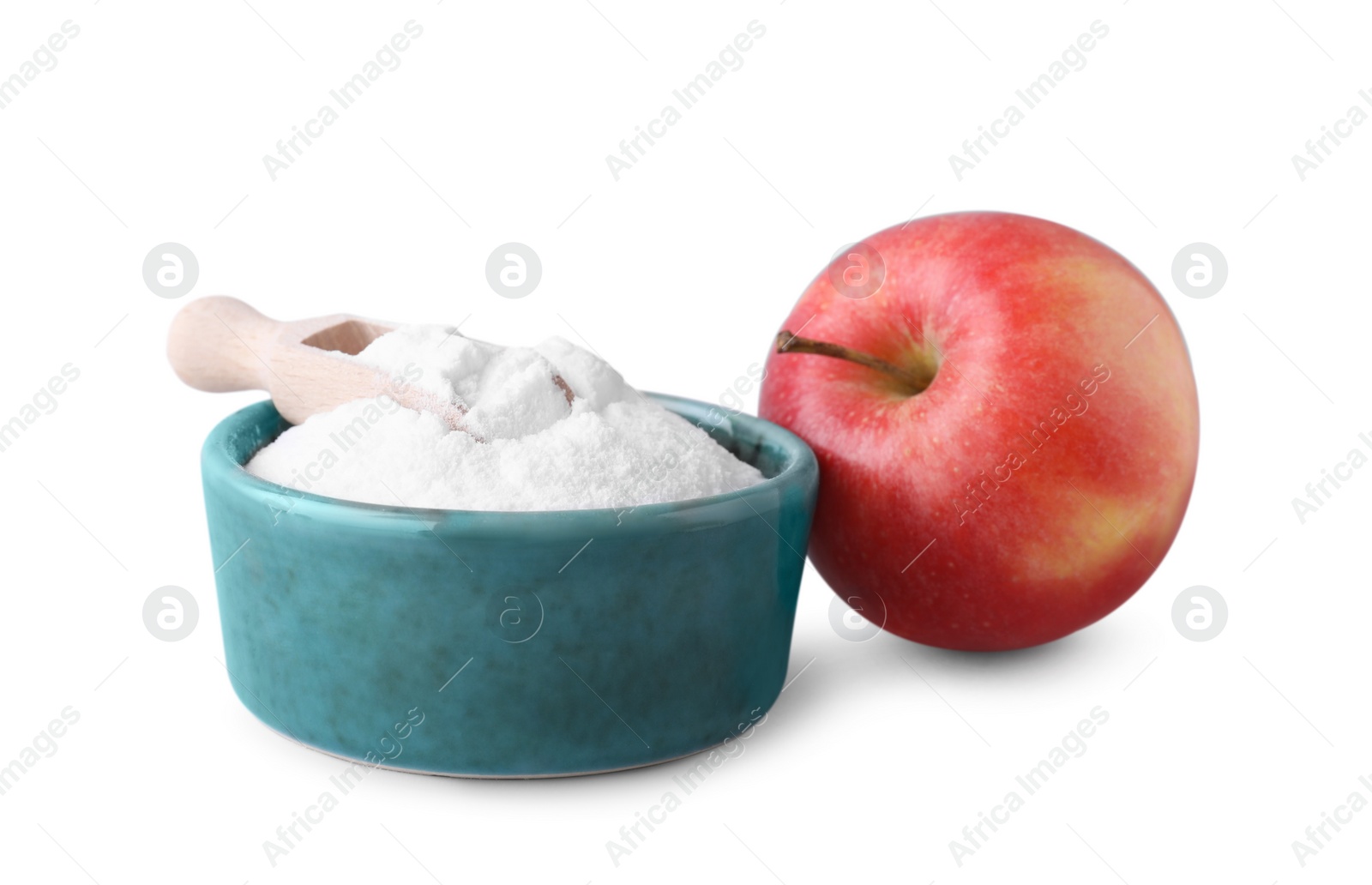 Photo of Bowl with sweet fructose powder, scoop and ripe apple on white background