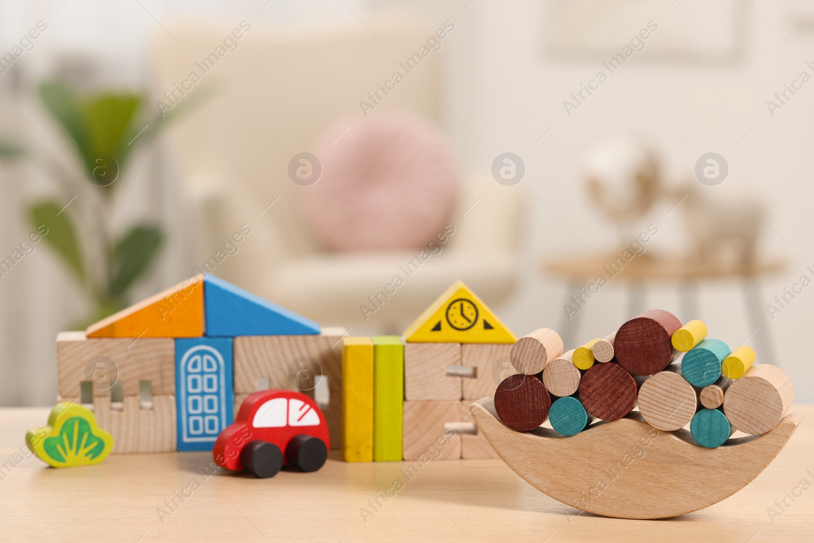 Photo of Set of wooden toys on table indoors, selective focus. Space for text. Children's development