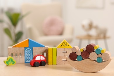 Set of wooden toys on table indoors, selective focus. Space for text. Children's development