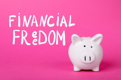 Words Financial Freedom and piggy bank on pink background