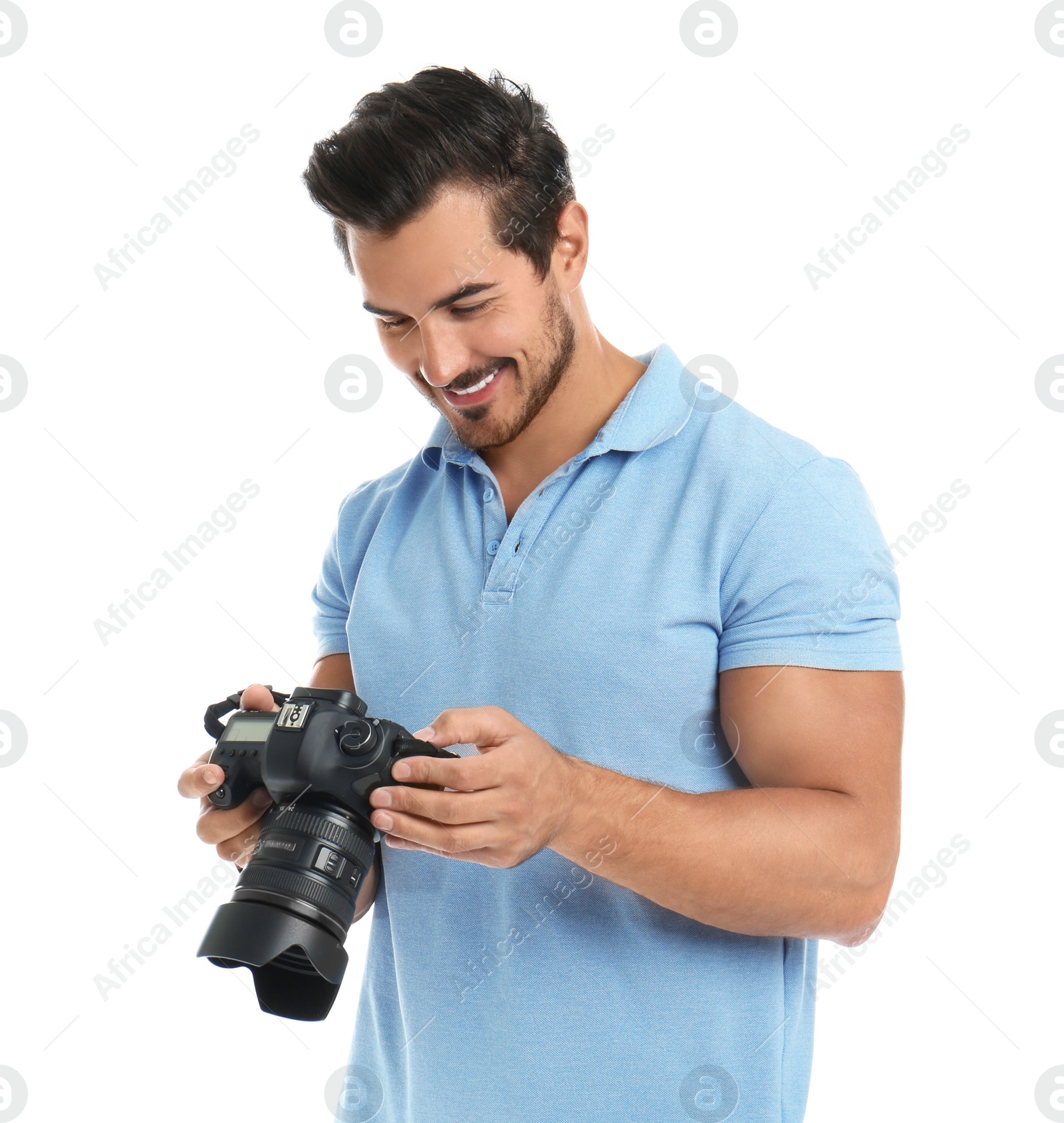 Photo of Young photographer with professional camera on white background