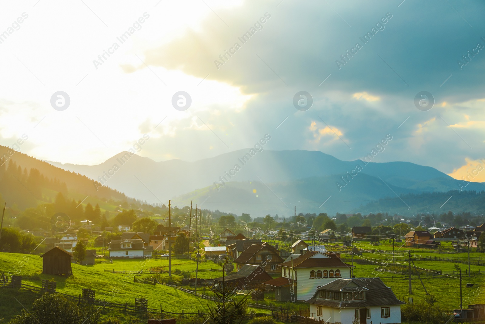 Photo of Picturesque view of village and forest on mountain slopes