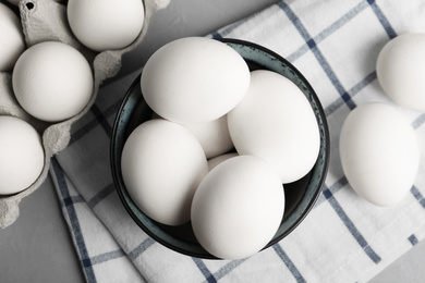 Photo of Flat lay composition with raw chicken eggs on grey table