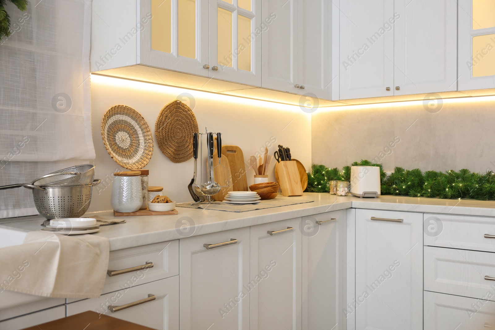 Photo of Kitchen countertop with festive decor. Christmas celebration