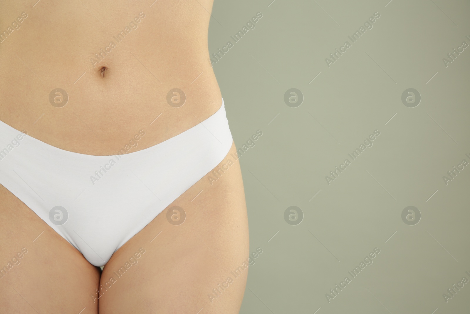 Photo of Gynecology. Woman in underwear on grey background, closeup. Space for text