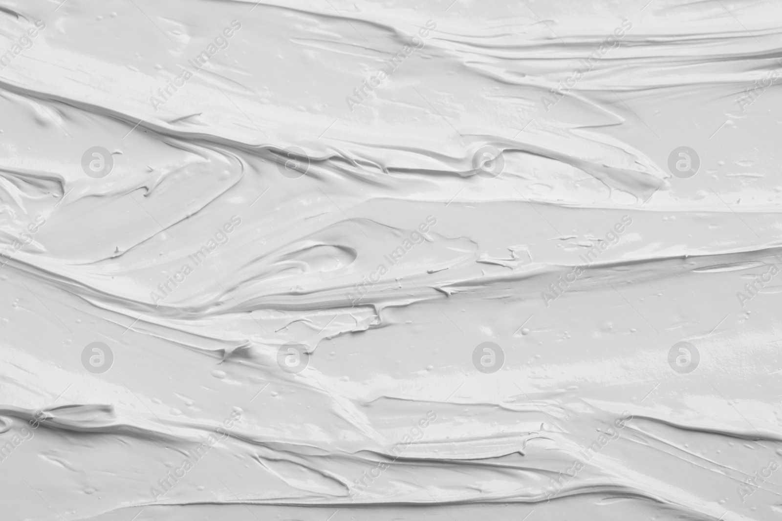 Photo of Texture of white oil paint as background, closeup