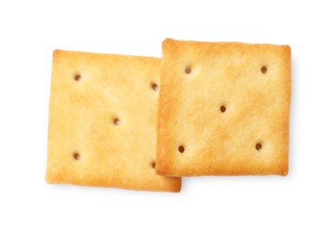 Two crispy crackers isolated on white, top view. Delicious snack