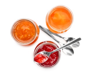 Photo of Three jars with tasty sweet jam on white background