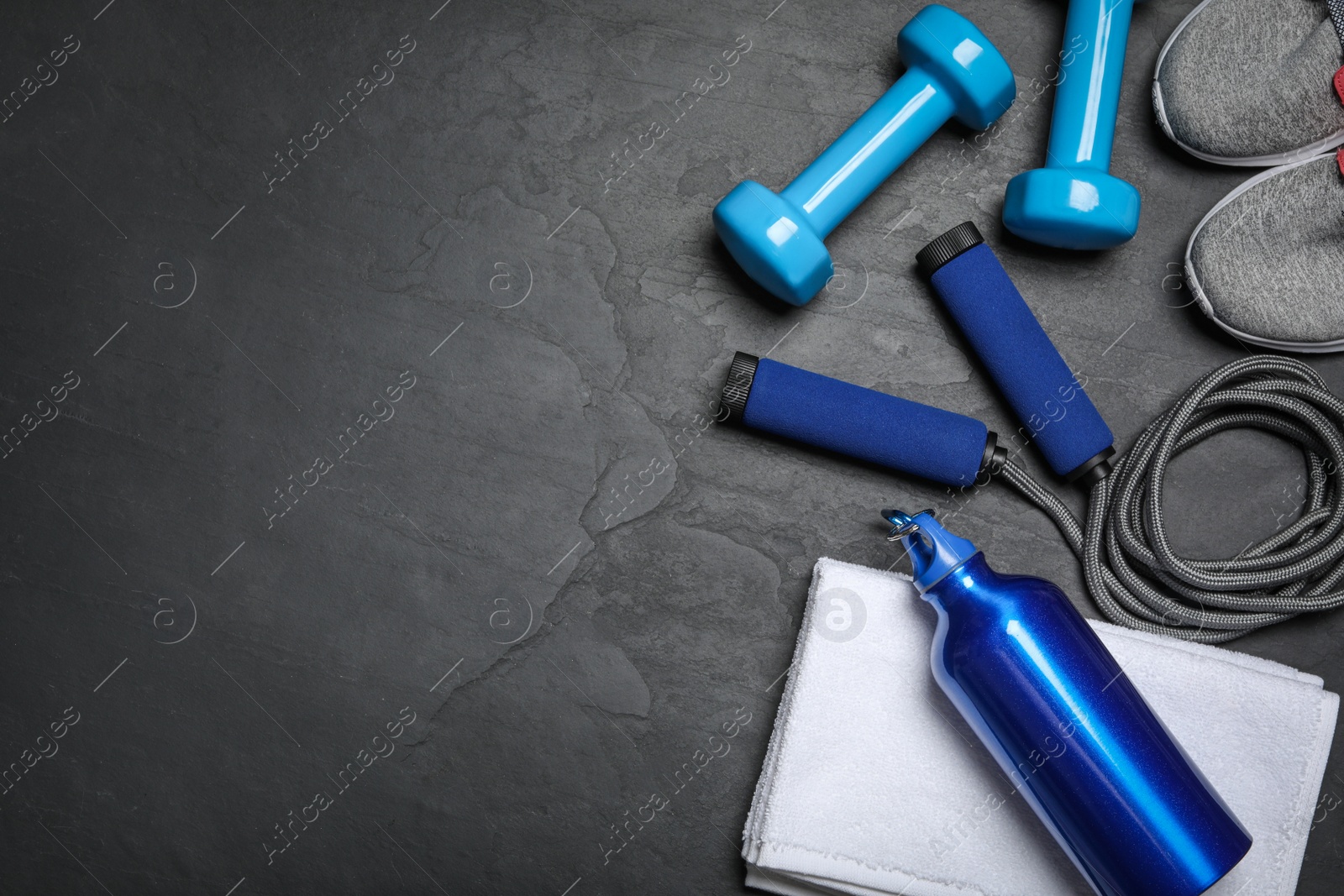 Gym equipment on black background, flat lay. Space for text Photo of Gym equipment on black background, flat lay. Space for text