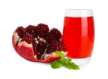 Photo of Refreshing pomegranate juice in glass, leaves and fruit isolated on white