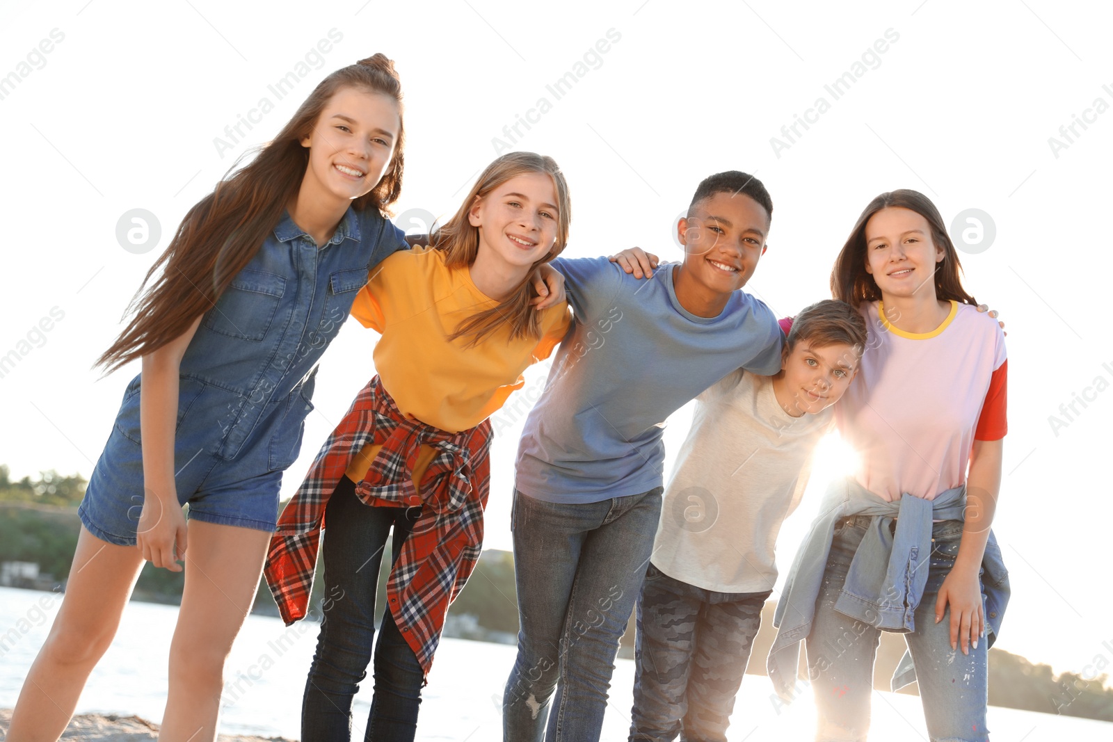 Photo of Group of children outdoors on sunny day. Summer camp