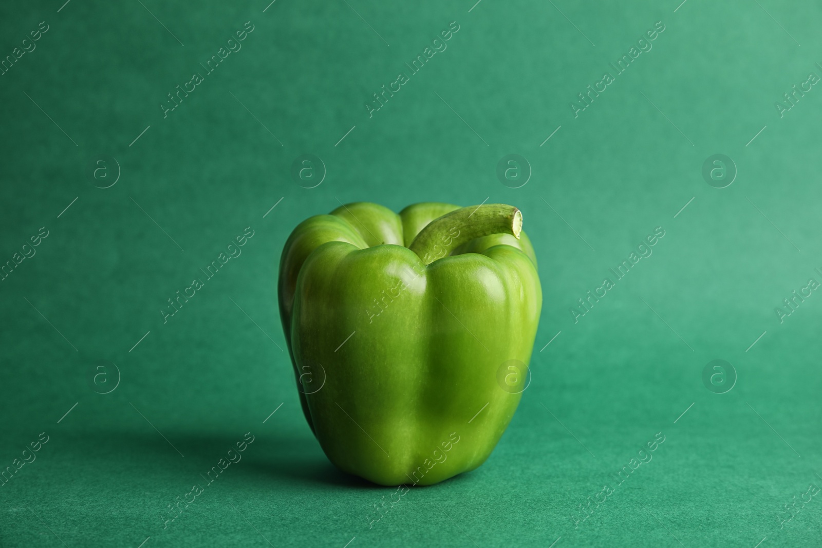 Photo of Raw ripe paprika pepper on color background