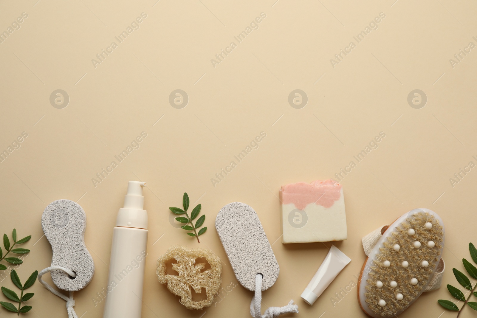 Photo of Flat lay composition with pumice stones on beige background. Space for text