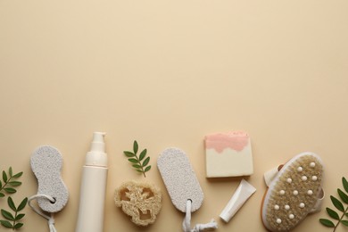 Flat lay composition with pumice stones on beige background. Space for text