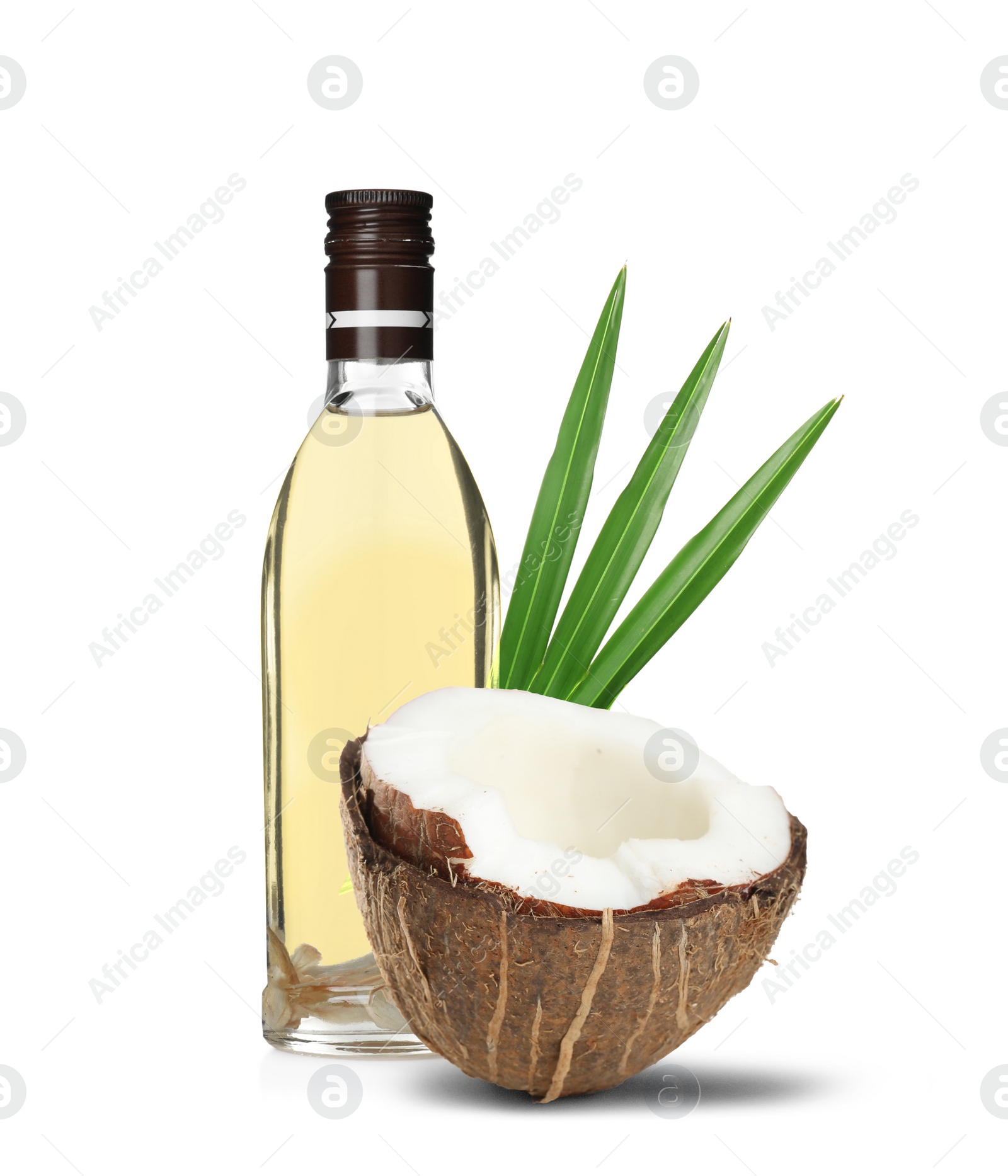 Image of Bottle of coconut cooking oil and fruit on white background