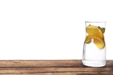 Delicious refreshing citrus drink on wooden table.