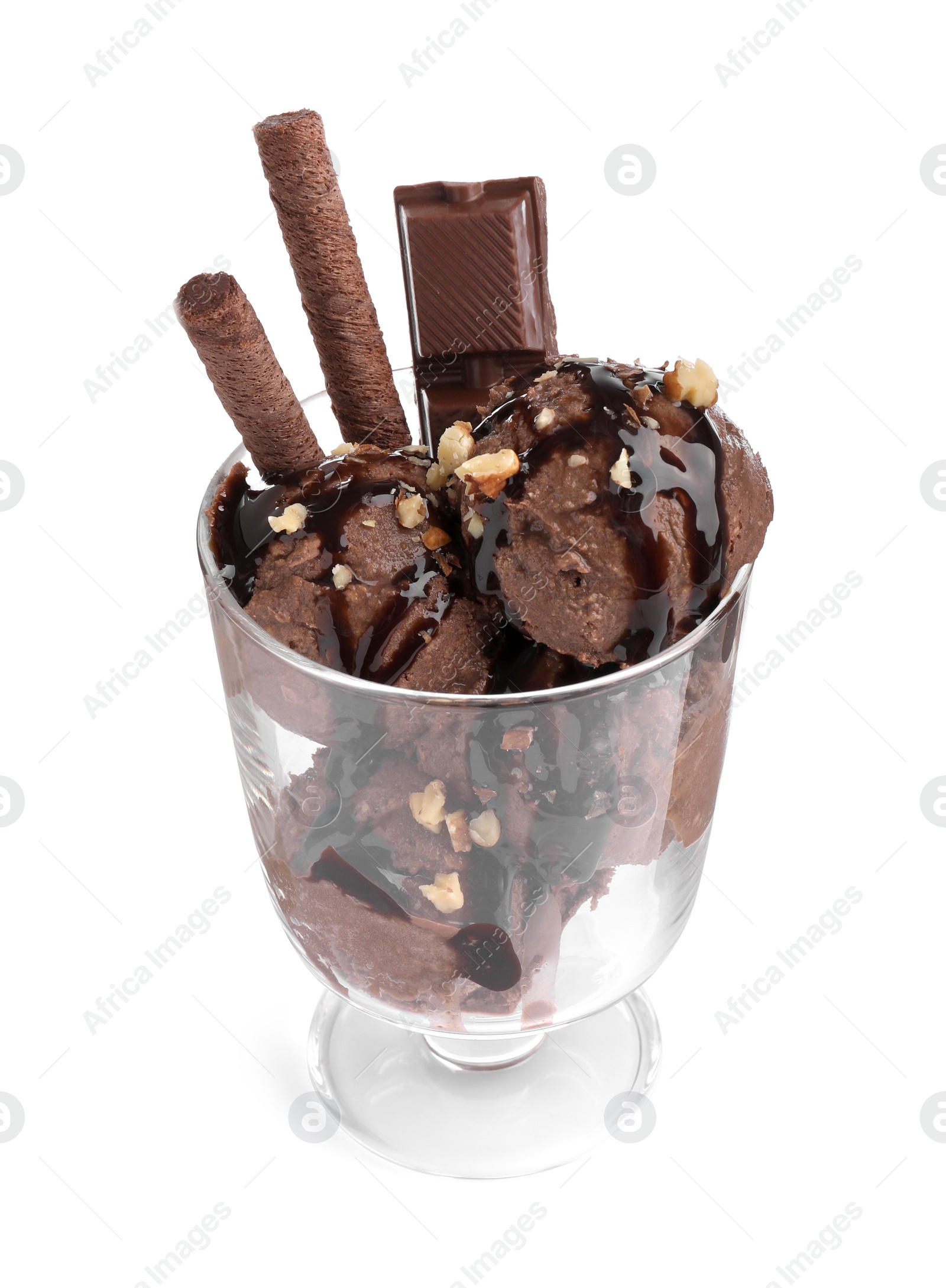 Photo of Glass dessert bowl of tasty ice cream with chocolate sauce, nuts and wafer rolls isolated on white