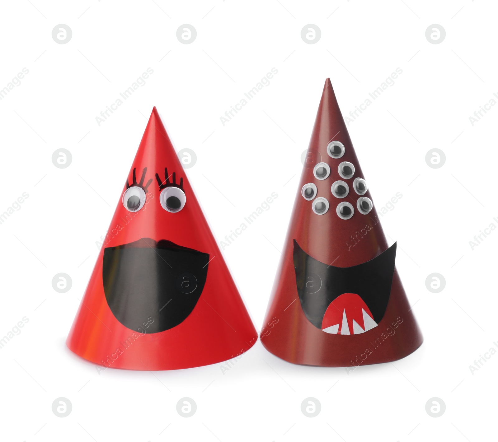 Photo of Funny monsters on white background. Halloween decoration